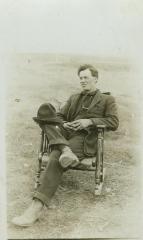 Unidentified middle-aged man in rocking chair