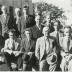 Twelve men on the steps of the courthouse