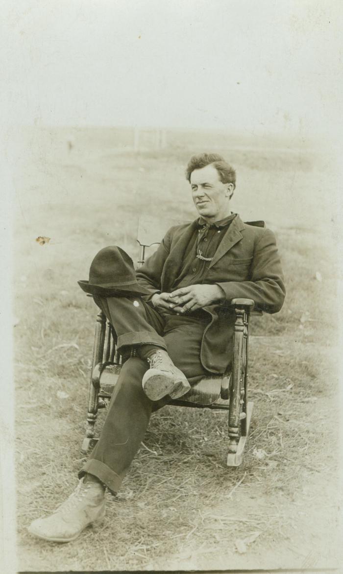 Unidentified middle-aged man in rocking chair