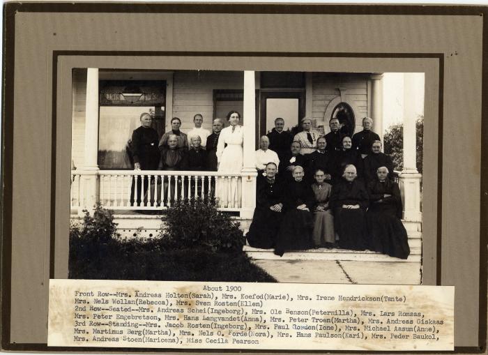 Ladies Group of Indherred Lutheran Church on front porch of a home