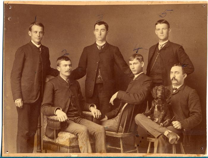 Group of six men with dog