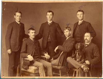Group of six men with dog
