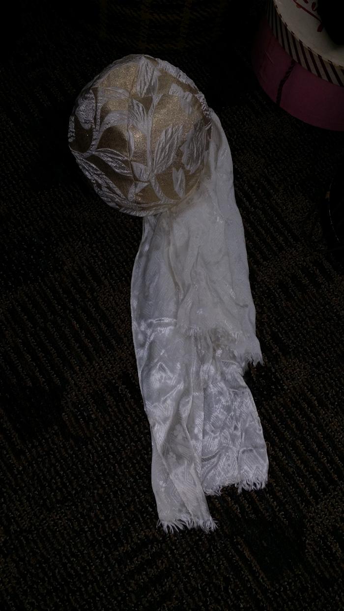 Wedding dress and veil donated by Carolyn Anderson.