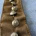 9 silver-toned buttons