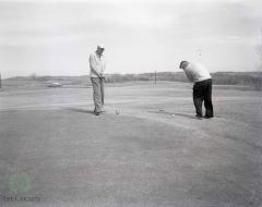 Warming Up Their Golf Clubs, Gilman Gandrud And Al Fjoslien, Long Beach, Minnesota 