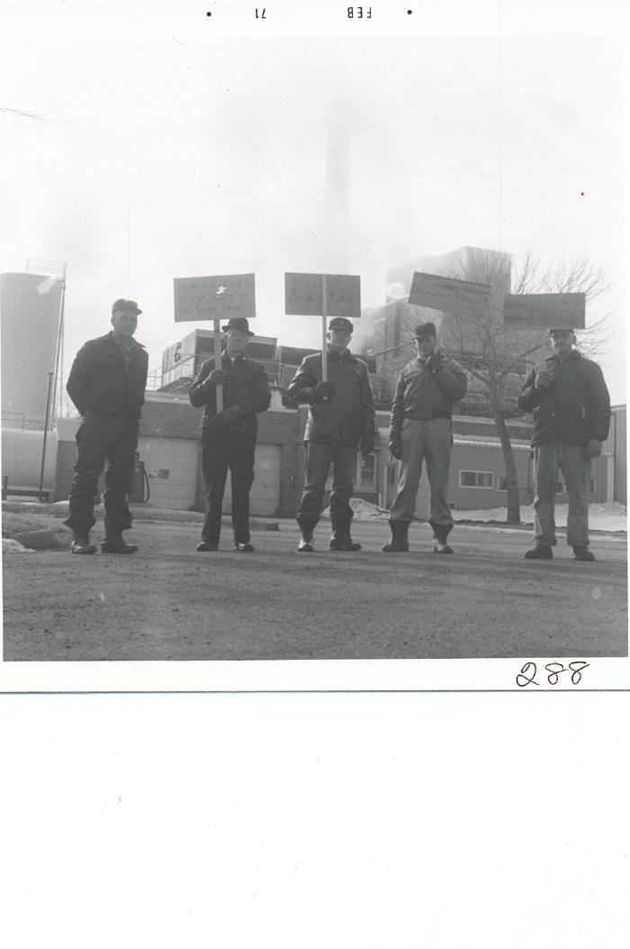 men carrying signs in front of Land O'Lakes, 1971
