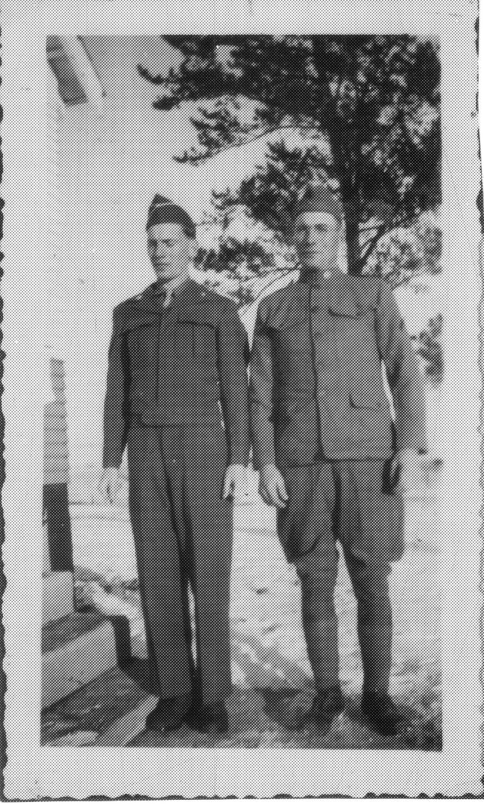 Selmer "Sam" Peterson wearing WWI uniform and son Robert wearing WWII uniform, Dec 1946