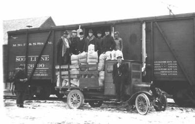 The beginning of a good job.  Unloading 40,000# of choice Idaho Alfalfa seed at Henning, 1924.  This