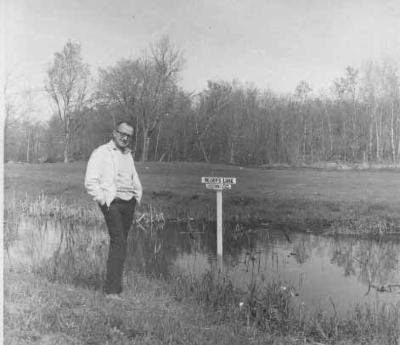 Tuffy Nelson by water hazard of golf course