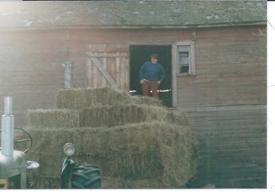 Ken Bruentrup loading hay into the Howlett barn