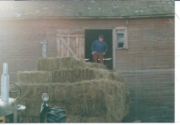 Ken Bruentrup loading hay into the Howlett barn