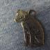 Dog-shaped metal charm from Glenwood Furniture Company