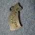 Dog-shaped metal charm from Glenwood Furniture Company