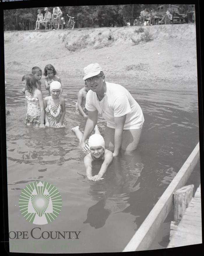 Red Cross water safety instructor Vernon Maetzold at Glenwood, Minnesota swimming beach
