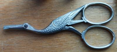 chest, sewing;  spools, thread; skein, floss; embroidery scissors; sewing thimble