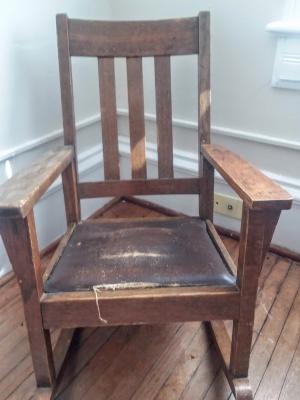 Brown child's rocking chair