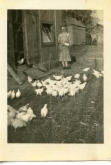 Mary Weber Feeding Chickens
