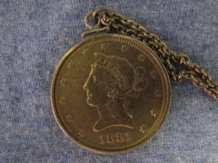 1881 gold coin on a chain