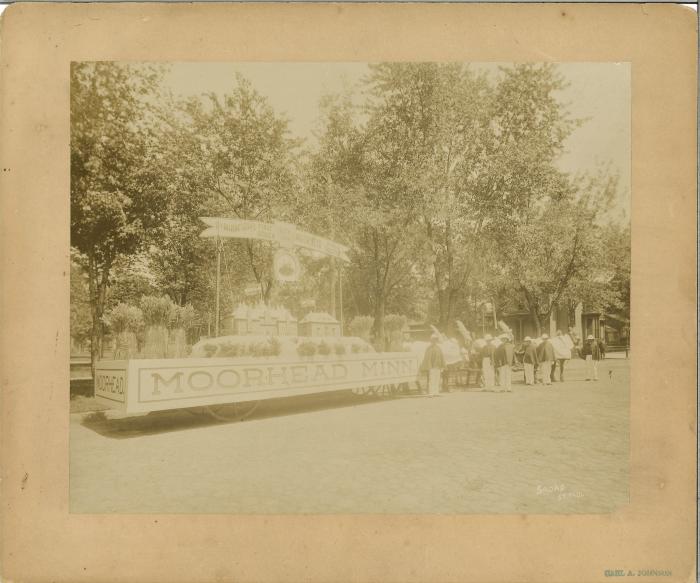 Moorhead parade float, ca. 1880s, "Minnesota's First Citizen" "Key City" "Moorhead, Minn."