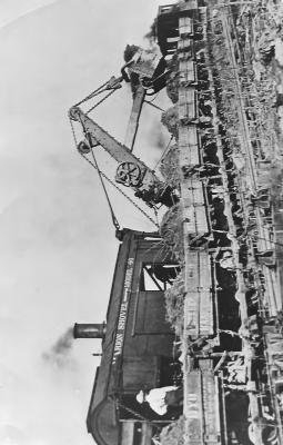 The latest equipment in 1919 loading railroad cars while Soo Line being built.