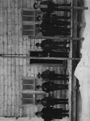 Group of men in front of building in Mallard.