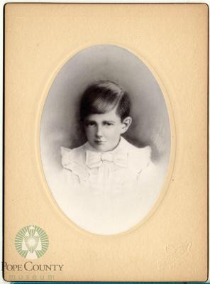 Young boy with white shirt and bow tie