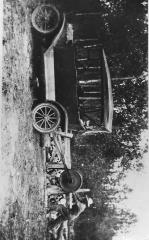 People - John Olson sawing wood with a Model-T,
