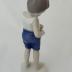 Sculpture - Boy buttoning short pants