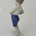 Sculpture - Boy buttoning short pants