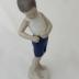 Sculpture - Boy buttoning short pants