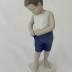 Sculpture - Boy buttoning short pants