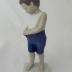 Sculpture - Boy buttoning short pants