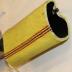 Section of Highlighter Yellow Fire Hose With Red and Black Stripes 