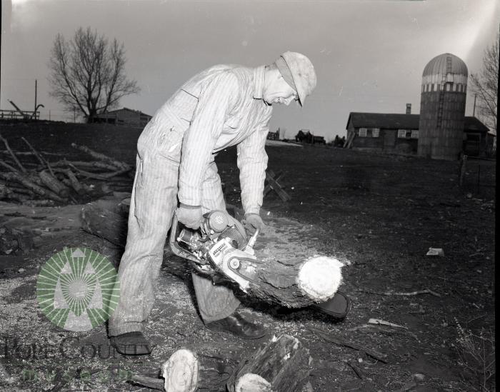 Clinton Overson using a Lomard chainsaw in Glenwood Minnesota