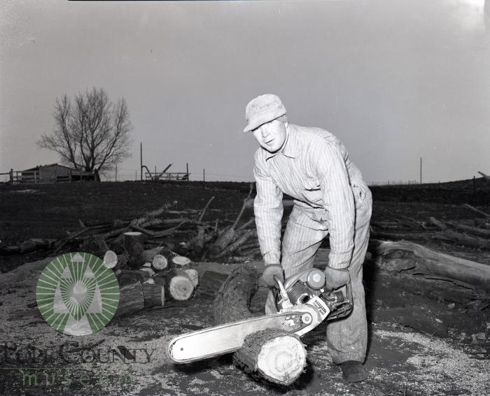 Clinton Overson using a Lomard chainsaw in Glenwood Minnesota