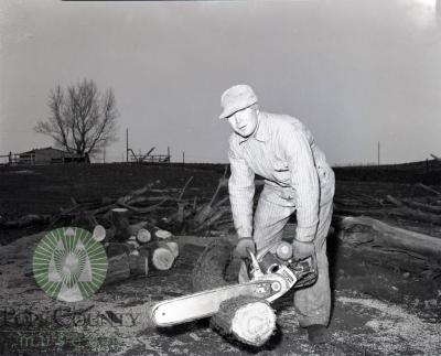 Clinton Overson using a Lomard chainsaw in Glenwood Minnesota