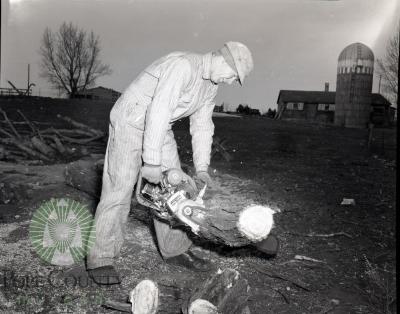 Clinton Overson using a Lomard chainsaw in Glenwood Minnesota