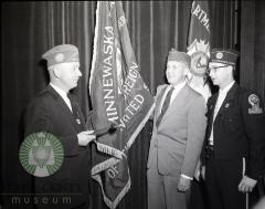 Glenwood, Minnesota American Legion toastmaster Ralph Cheeseman, Mayor Russ Torfin and Legion Comandor Bob Robards