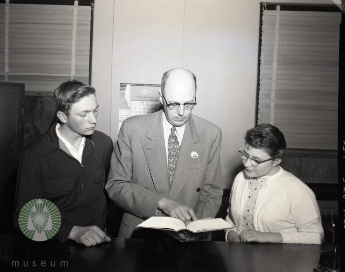 Burl Massman and Jane Vogland of Villard is with Judge Gilman P. Gandrud
