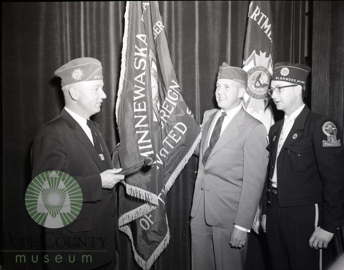 Glenwood, Minnesota American Legion toastmaster Ralph Cheeseman, Mayor Russ Torfin and Legion Comandor Bob Robards