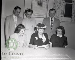 Chester Bennett and family admire savings bond. Lowry, Minesota