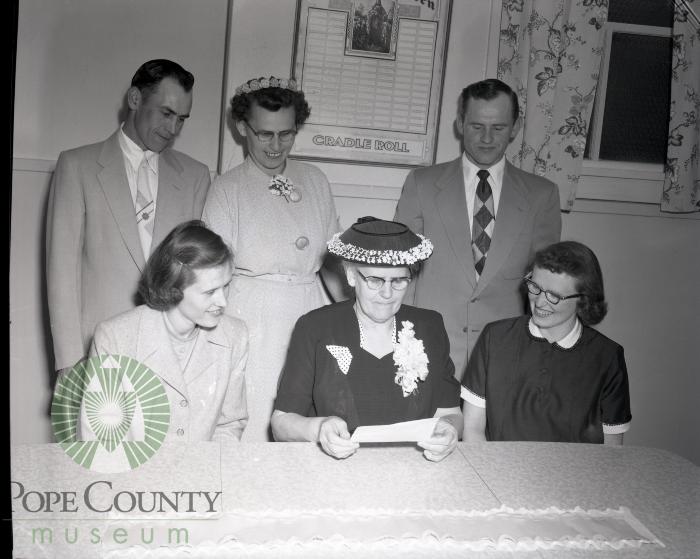 Chester Bennett and family admire savings bond. Lowry, Minesota