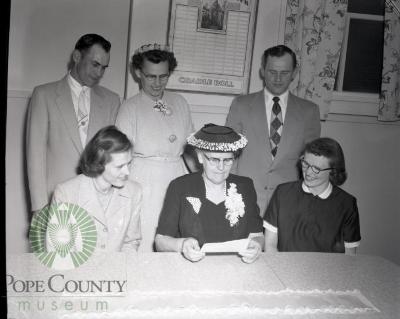 Chester Bennett and family admire savings bond. Lowry, Minesota