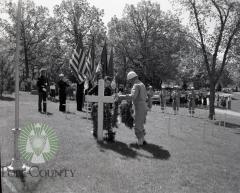 Officials decorate grave during the 1957 Memorial Day ceremonies. Glenwood, Minnesota