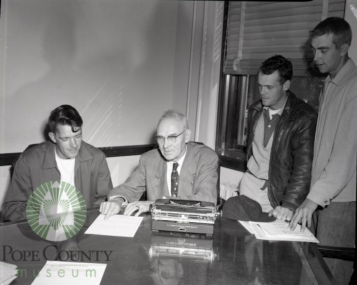 Korean War veterans get instructed on filling out forms. Glenwood, Minnesota