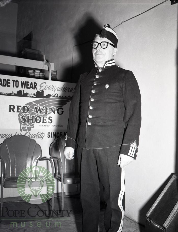 Knute Eide poses in his old Royal Guard uniform. Glenwood, Minnesota