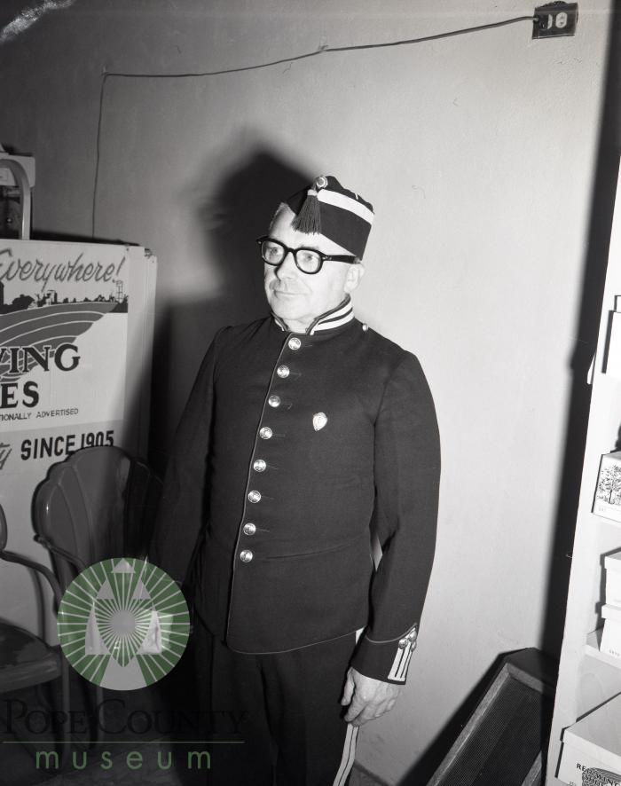 Knute Eide poses in his old Royal Guard uniform. Glenwood, Minnesota