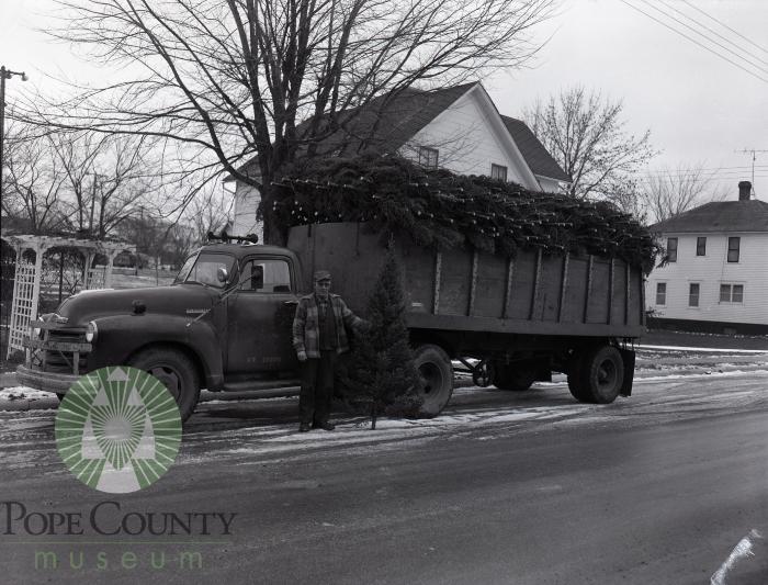 Gus Anderson delivers Christmas trees. Glenwood, Minnesota