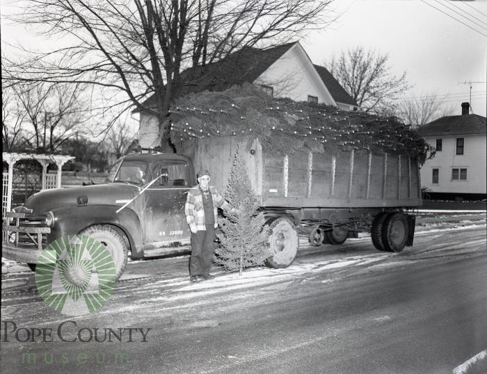 Gus Anderson delivers Christmas trees. Glenwood, Minnesota