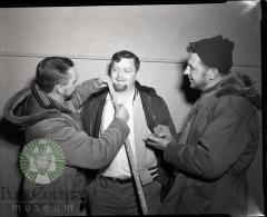 Jim Holtberg Measures Bill Birney's Whiskers. Glenwood, Minnesota